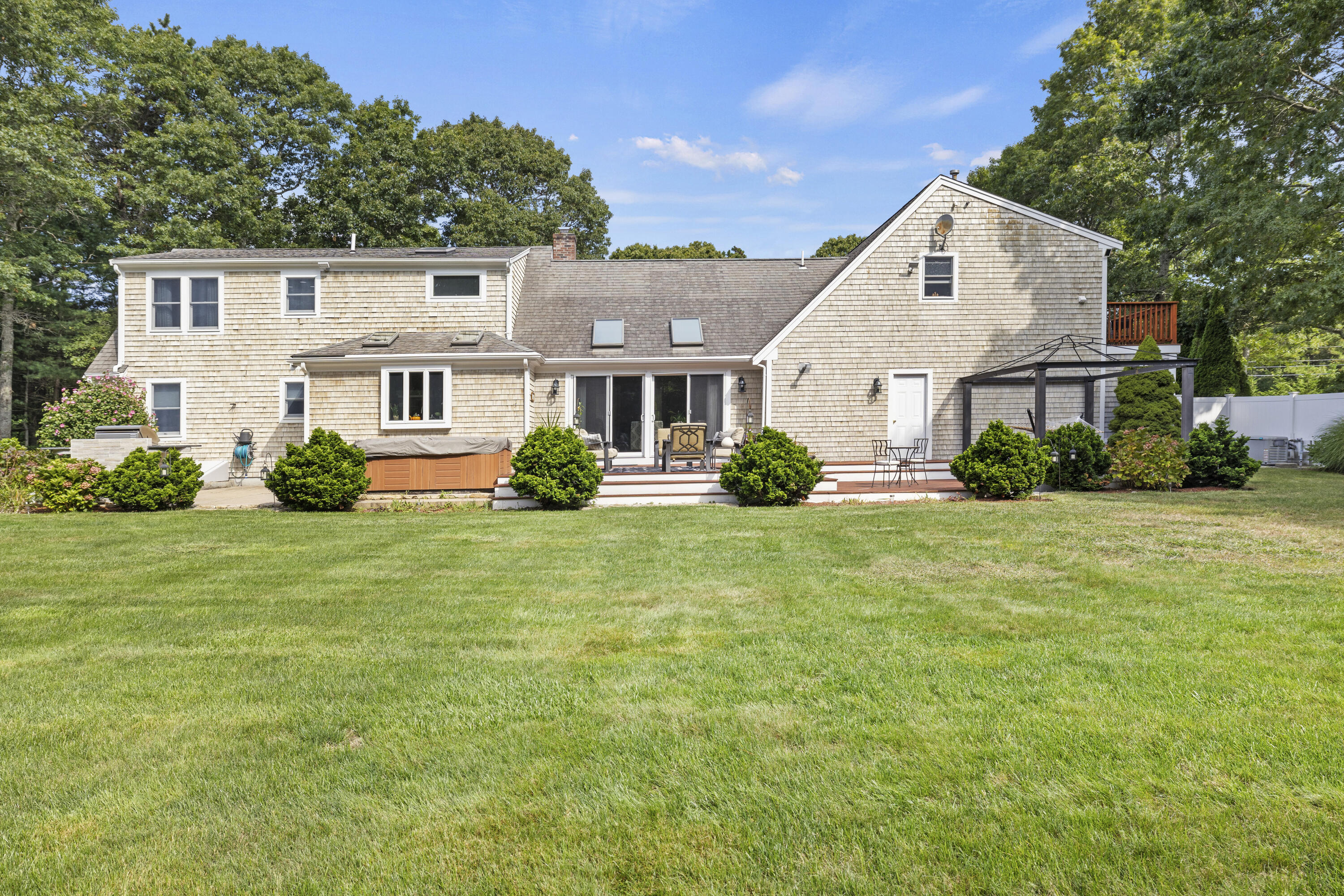 750 Old Barnstable Road Mashpee, MA 02649 - Photo 29 of 30 a front view of a house with garden