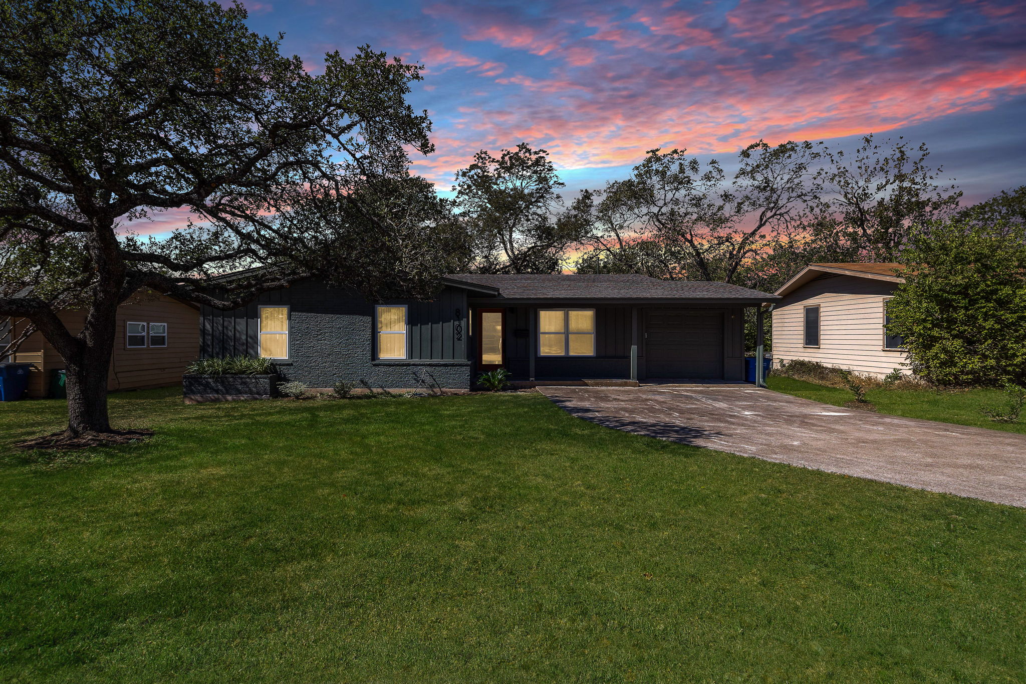 8102 Burrell Drive Austin, TX 78757 - Photo 3 of 35 a front view of a house with a garden