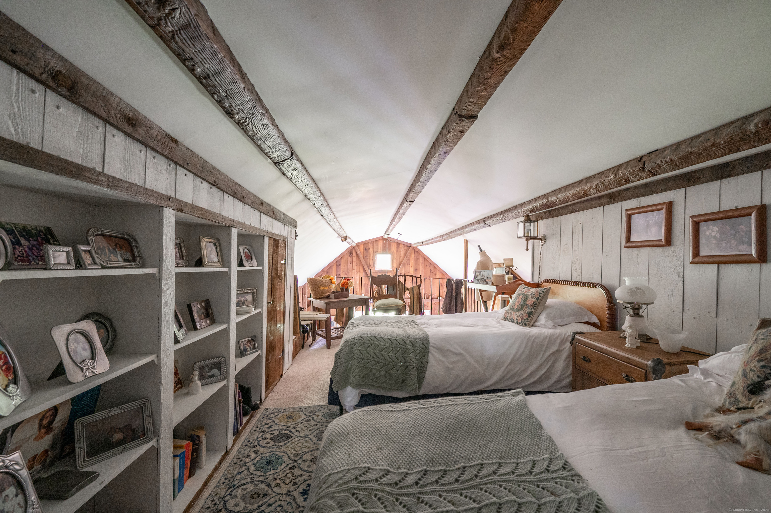 469 Platt Hill Road Winchester, CT 06098 - Photo 11 of 39 a bedroom with furniture and a chandelier