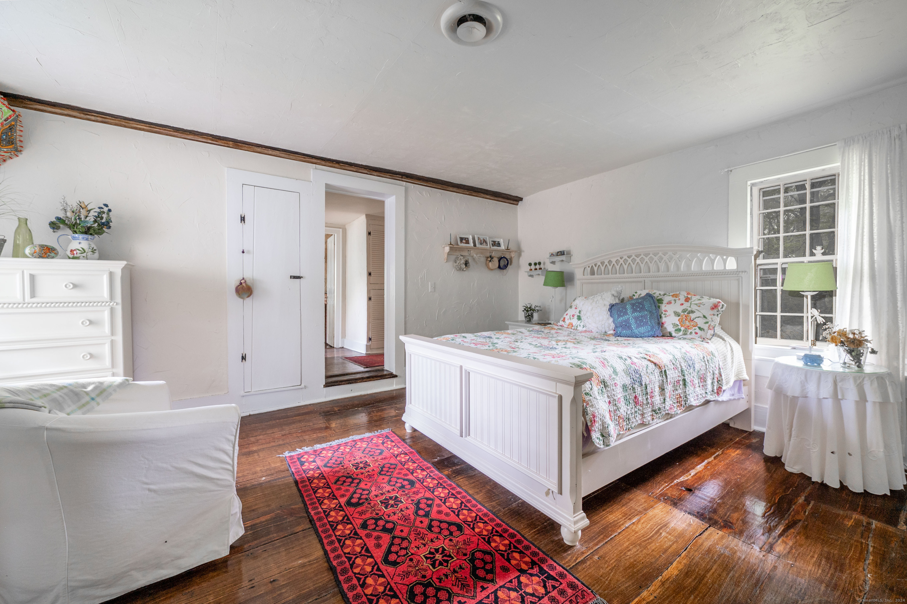 469 Platt Hill Road Winchester, CT 06098 - Photo 14 of 39 a bed room with a bed and a couch