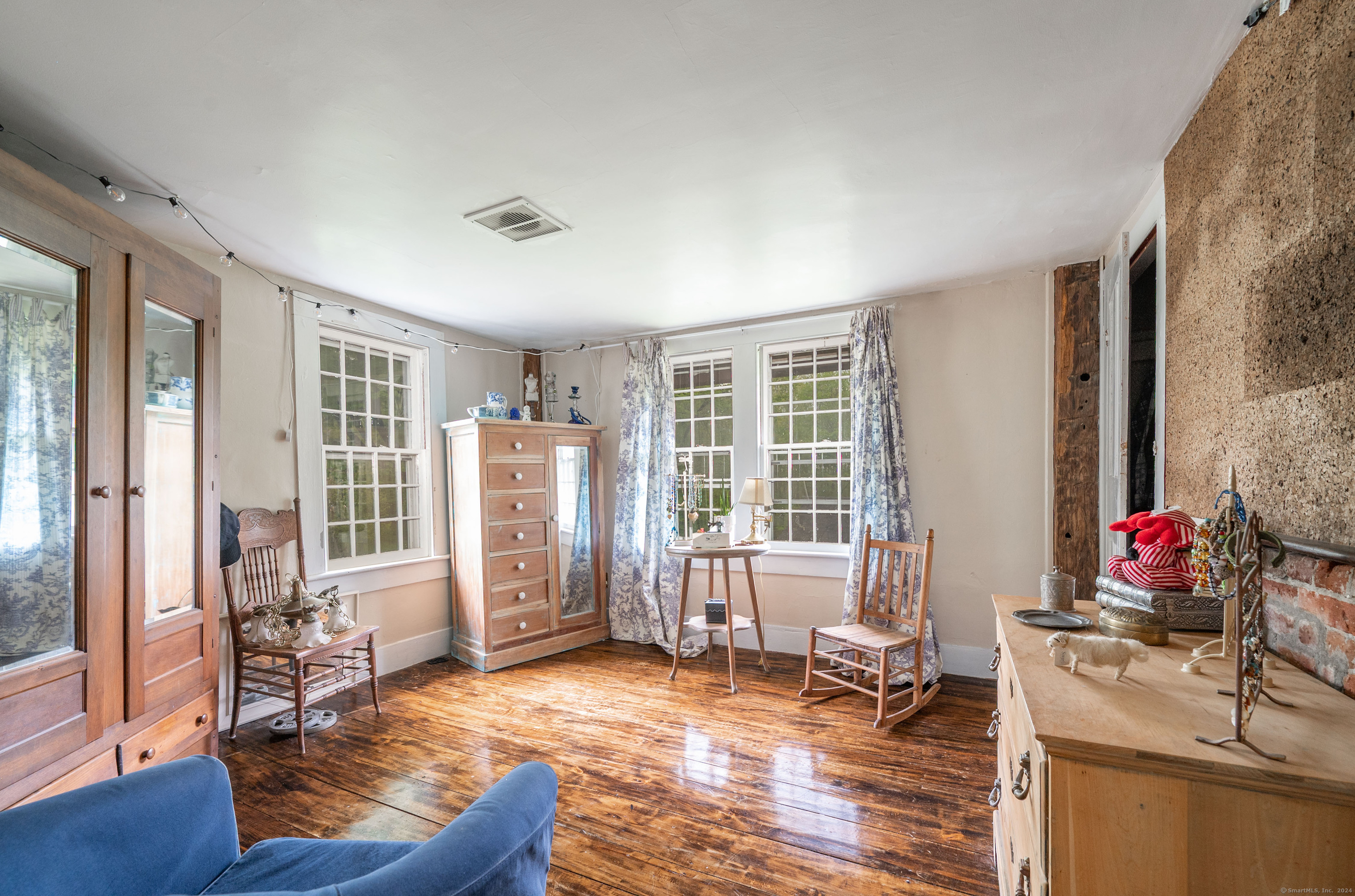 469 Platt Hill Road Winchester, CT 06098 - Photo 16 of 39 a living room with furniture and wooden floor