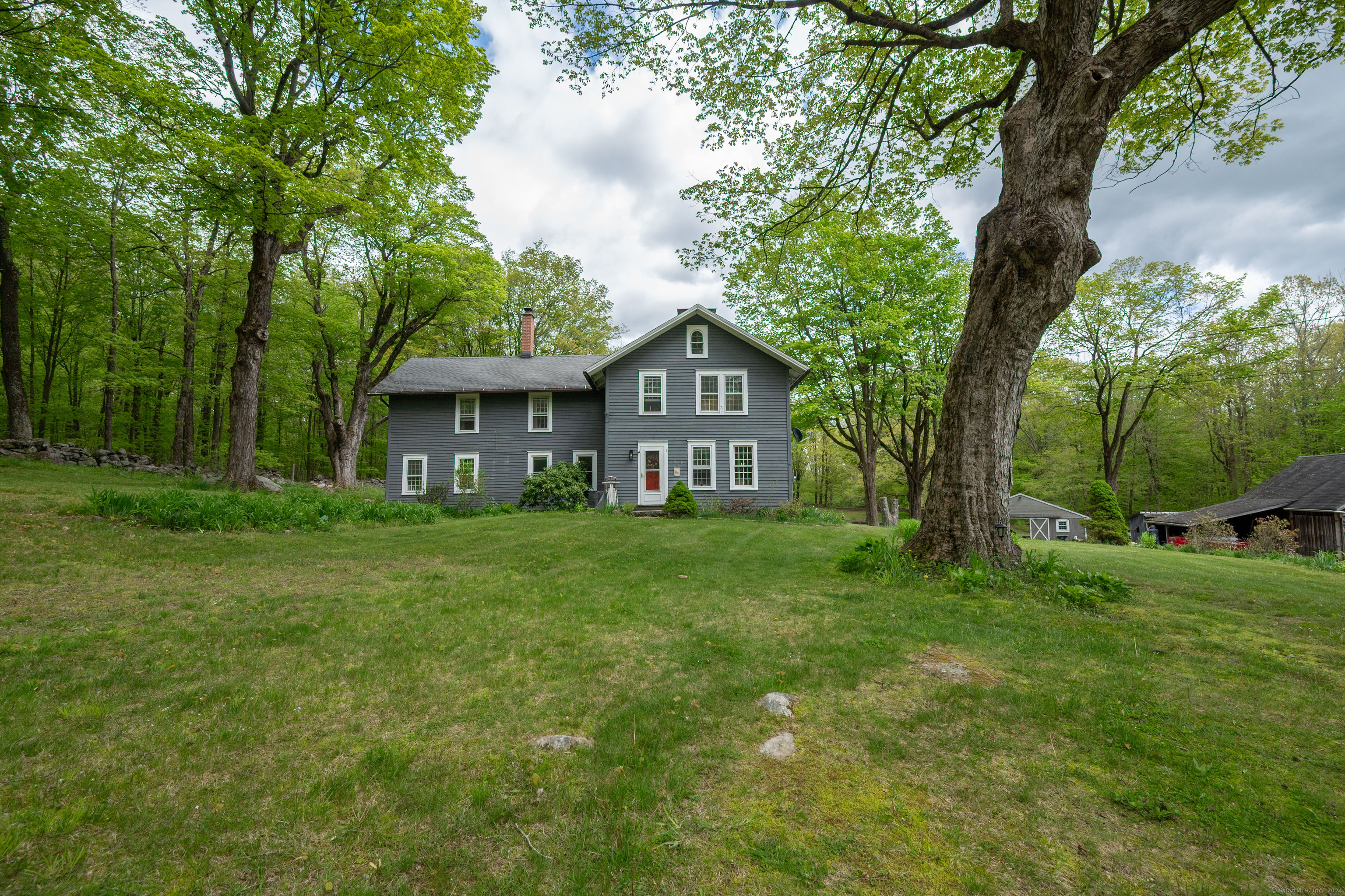 469 Platt Hill Road Winchester, CT 06098 - Photo 3 of 39 a front view of a house with a garden
