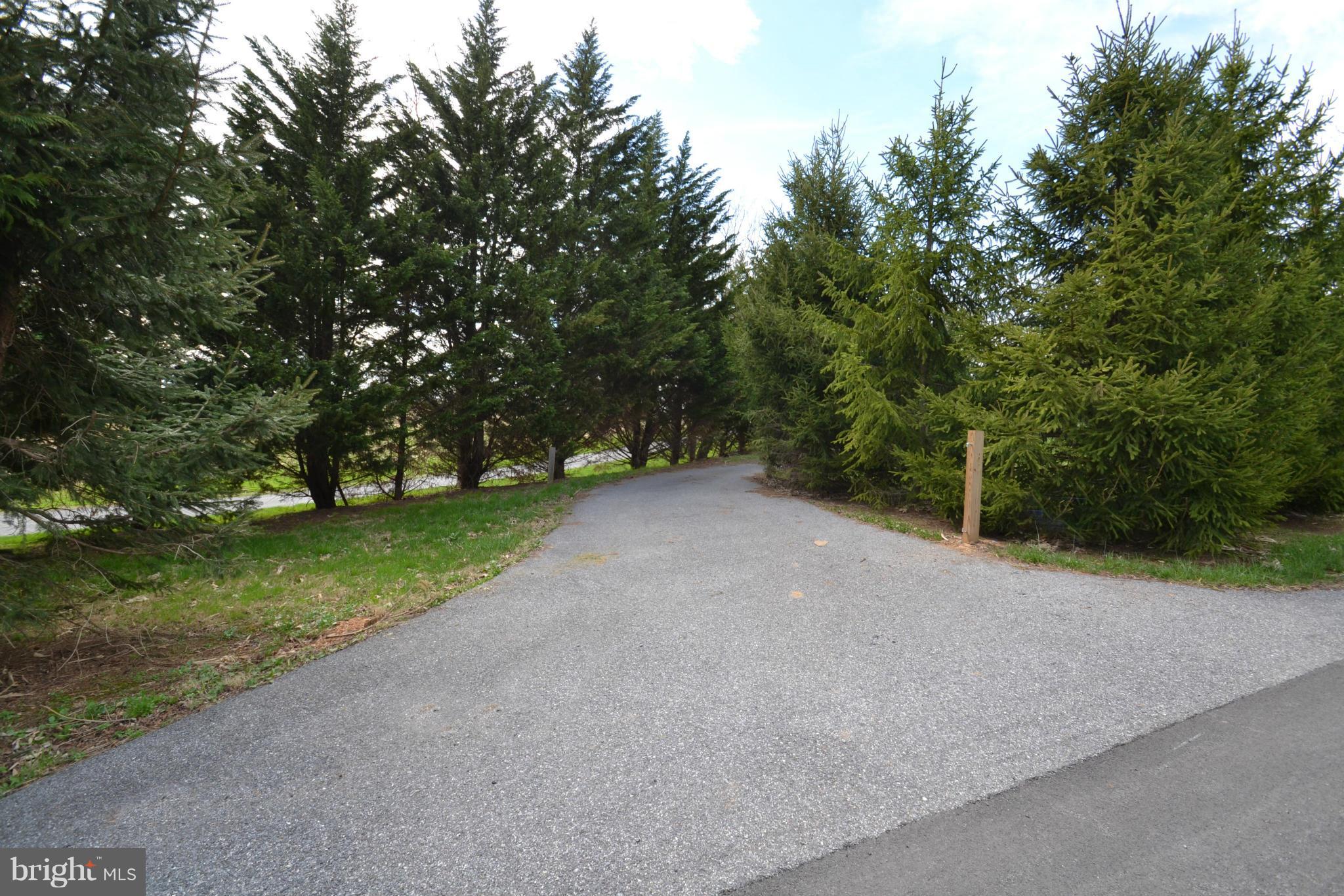 15300 Parrish Road Upperco, MD 21155 - Photo 2 of 30 a view of a field with trees in the background