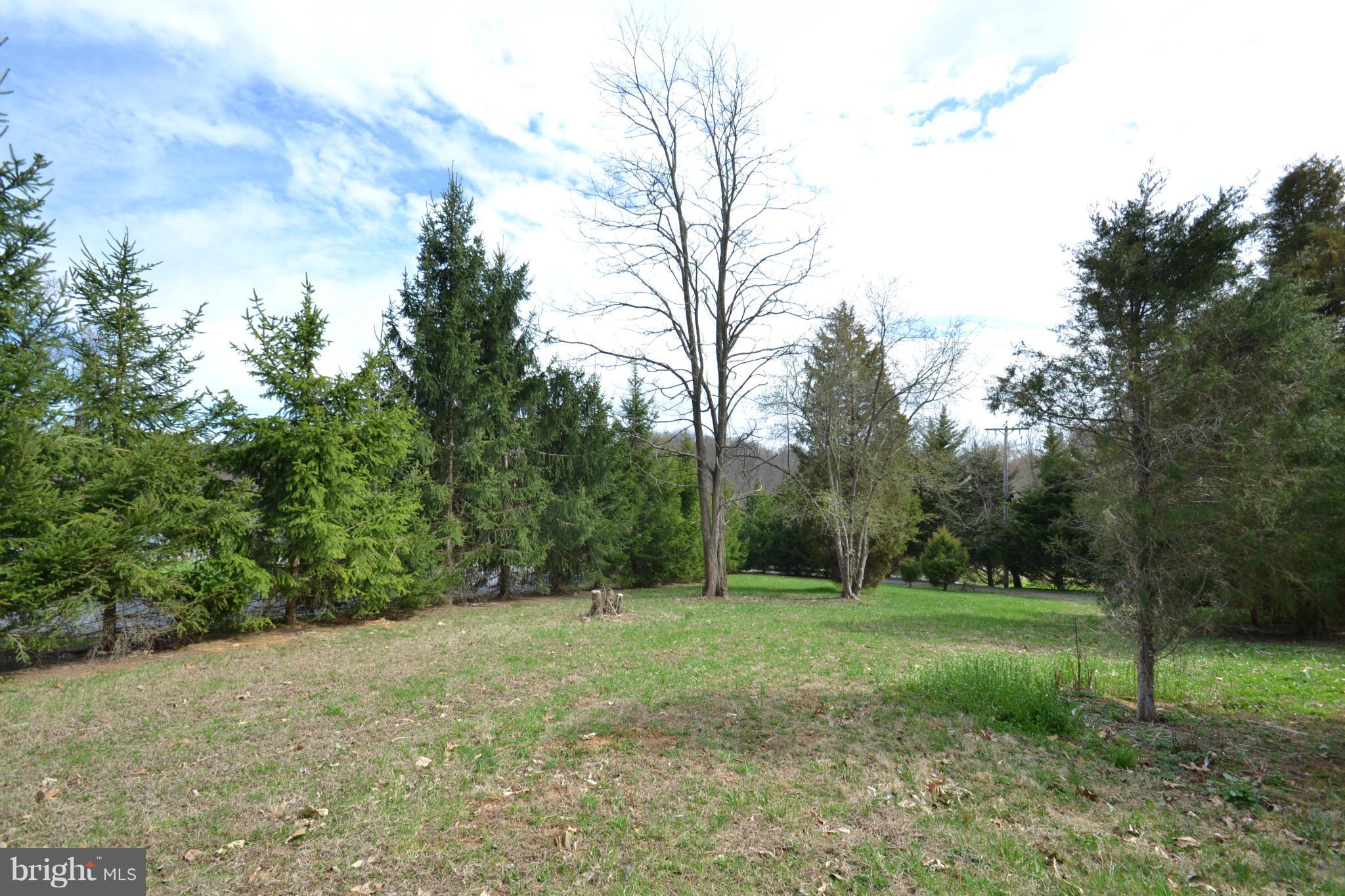15300 Parrish Road Upperco, MD 21155 - Photo 27 of 30 a view of a field with trees in the background