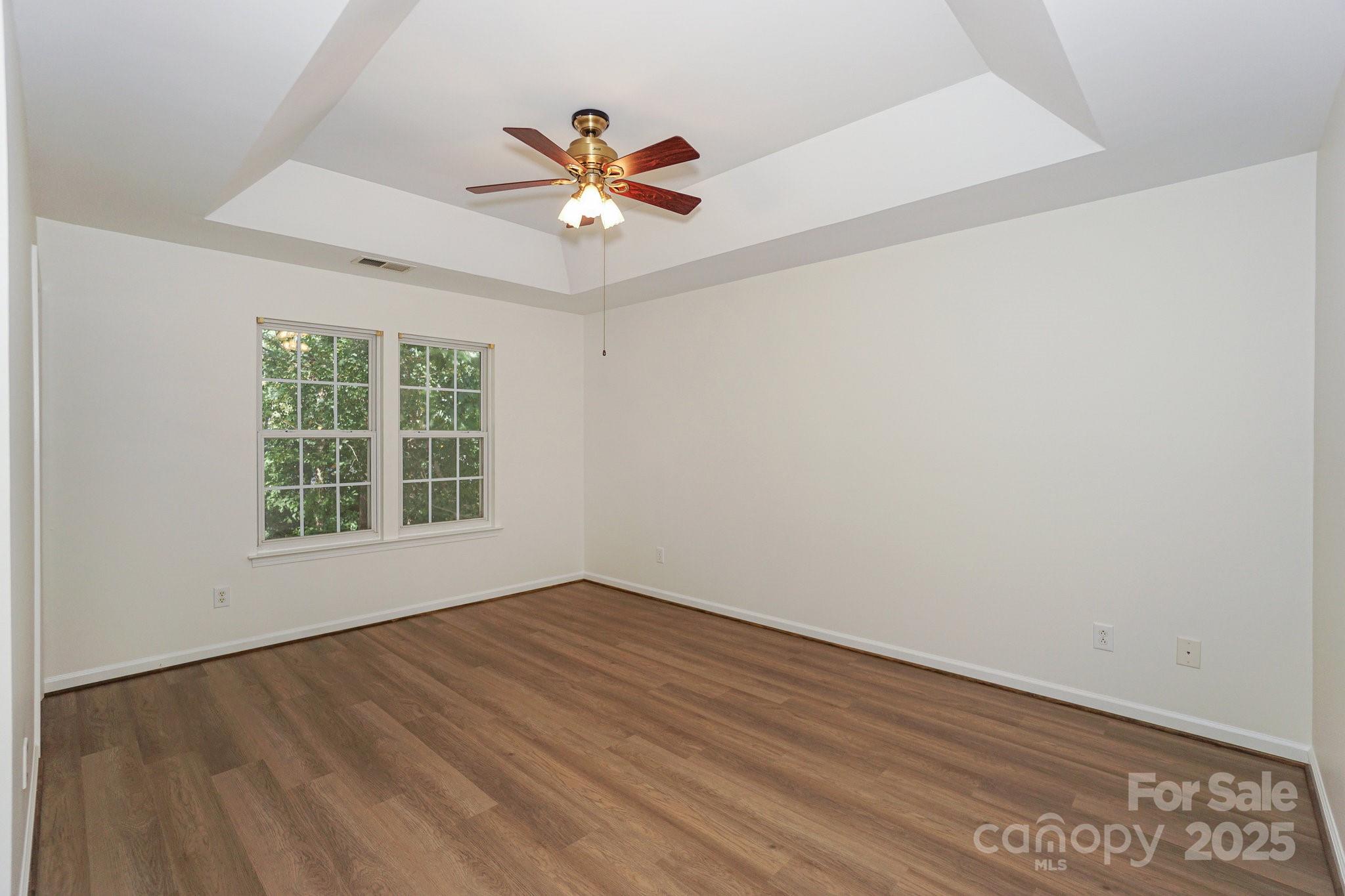 2485 Acadia Court Kannapolis, NC 28083 - Photo 15 of 34 wooden floor in an empty room with a window