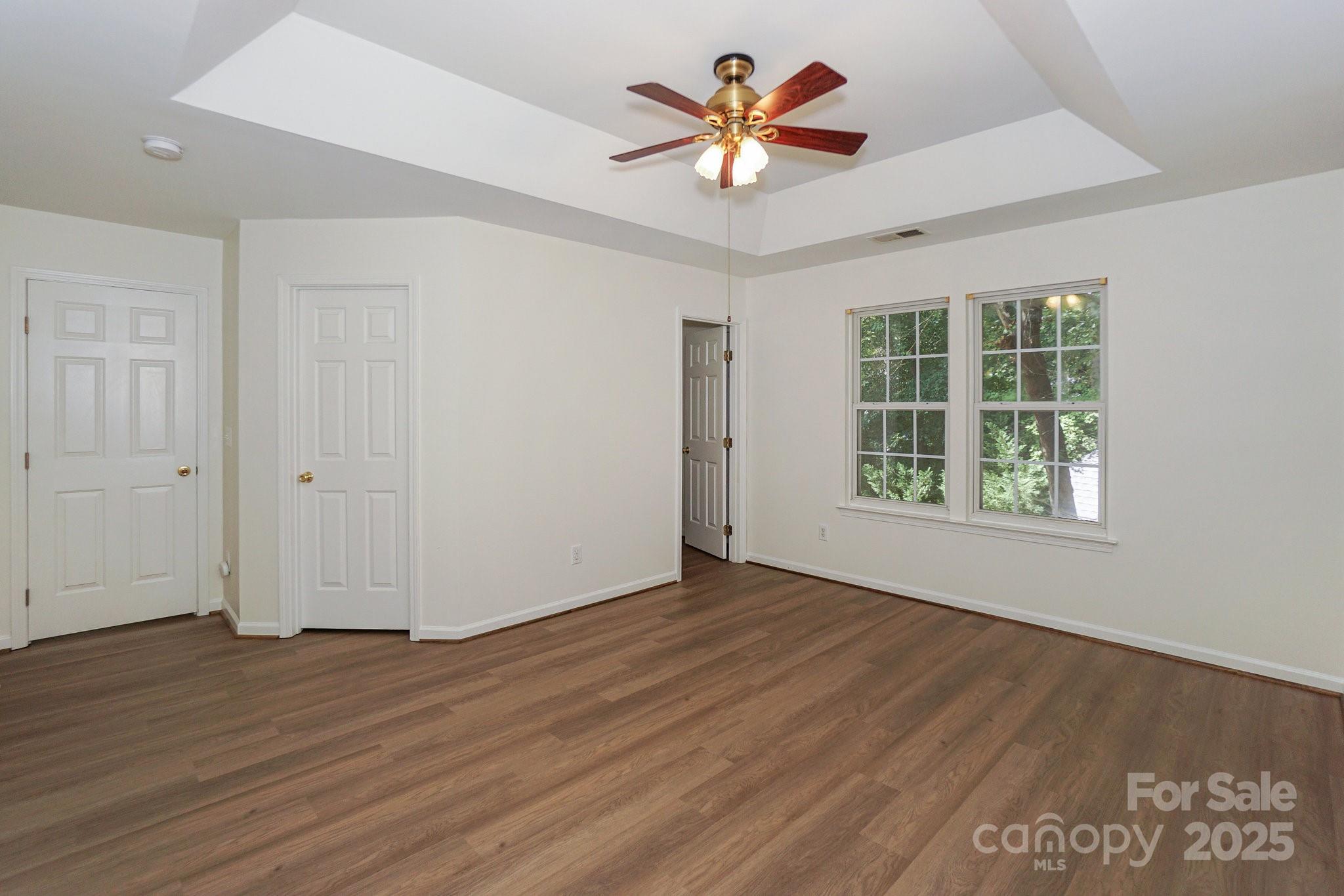 2485 Acadia Court Kannapolis, NC 28083 - Photo 16 of 34 an empty room with wooden floor and windows