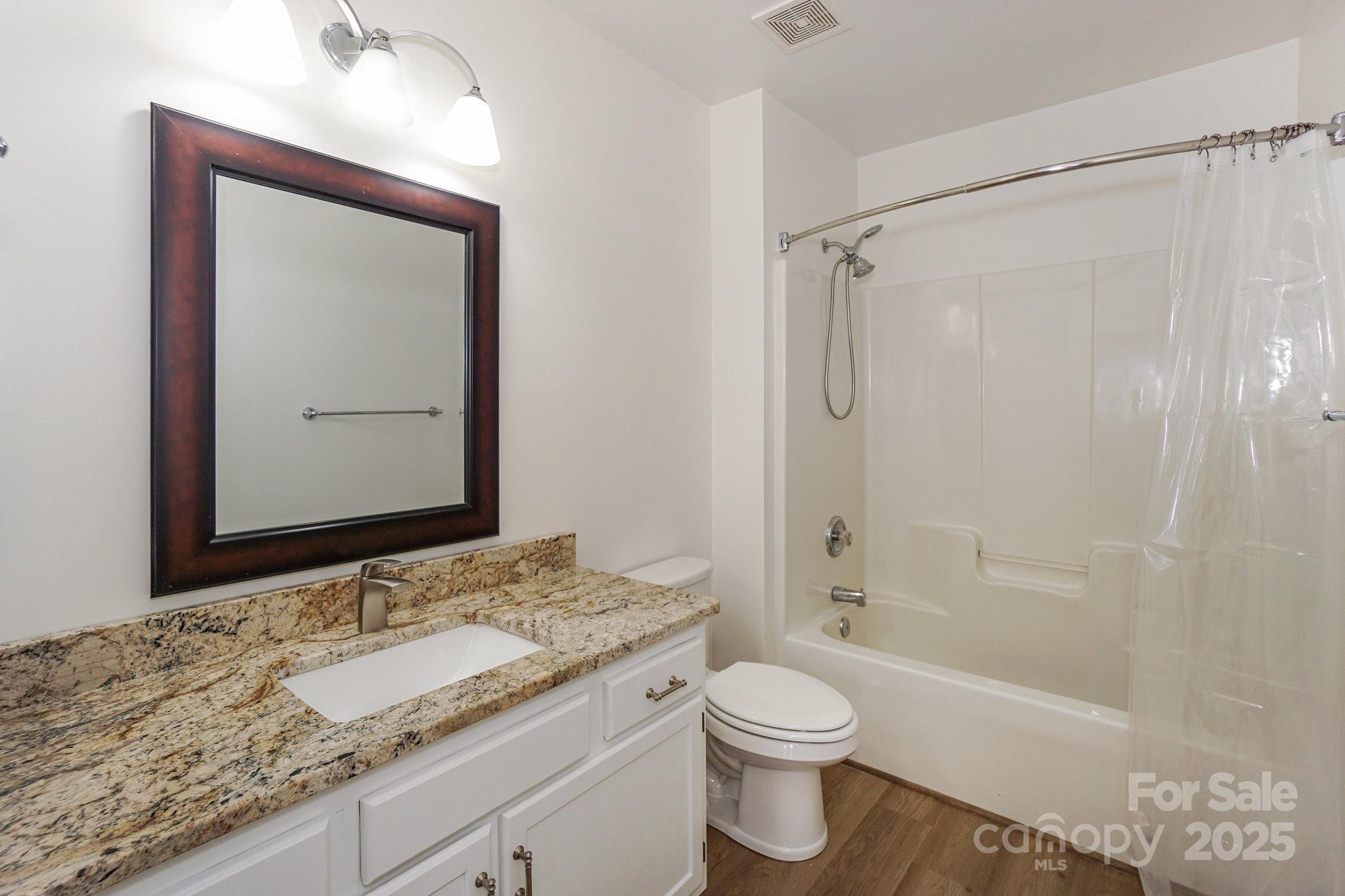 2485 Acadia Court Kannapolis, NC 28083 - Photo 24 of 34 a bathroom with a granite countertop sink toilet and shower