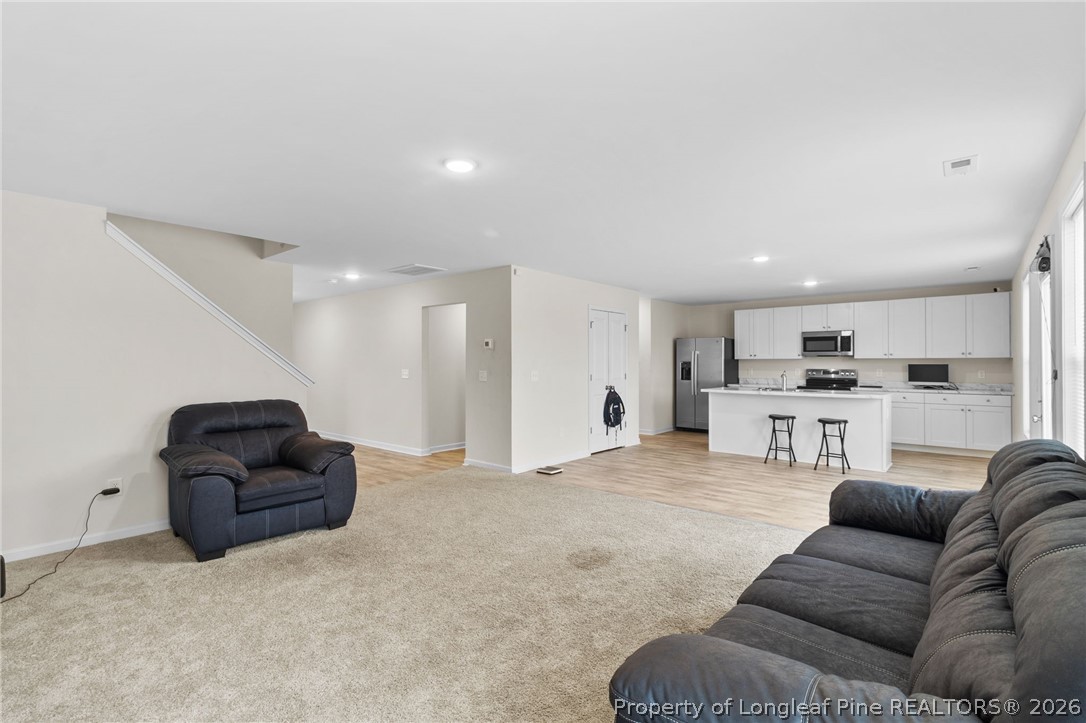33 Pointer Way Parkton, NC 28371 - Photo 11 of 44 a living room with furniture and kitchen view