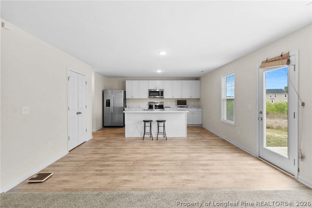 33 Pointer Way Parkton, NC 28371 - Photo 12 of 44 a kitchen with stainless steel appliances kitchen island sink refrigerator and cabinets