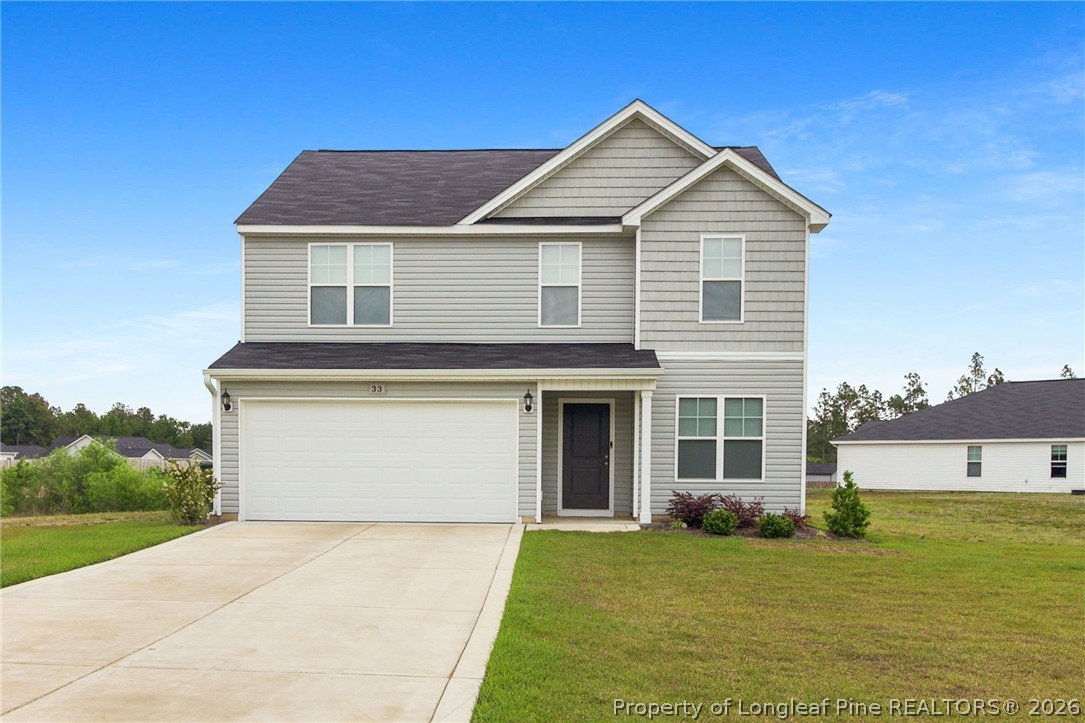 33 Pointer Way Parkton, NC 28371 - Photo 2 of 44 a front view of a house with a yard