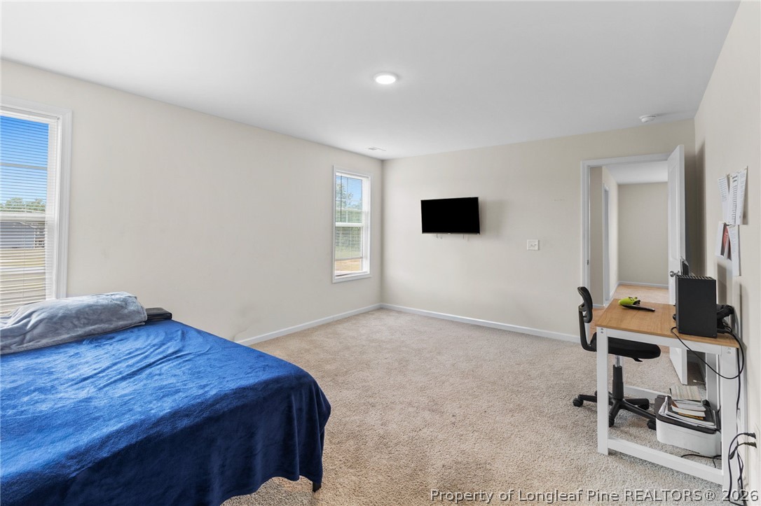 33 Pointer Way Parkton, NC 28371 - Photo 22 of 44 a bedroom with a bed and a window