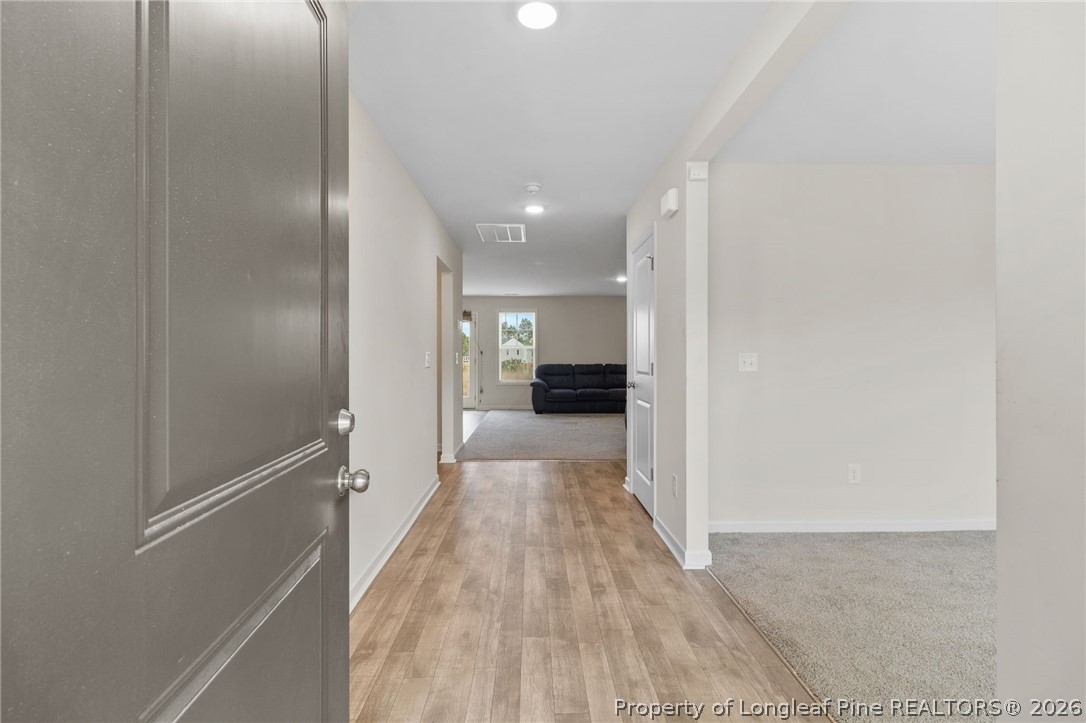 33 Pointer Way Parkton, NC 28371 - Photo 6 of 44 a view of a hallway with wooden floor