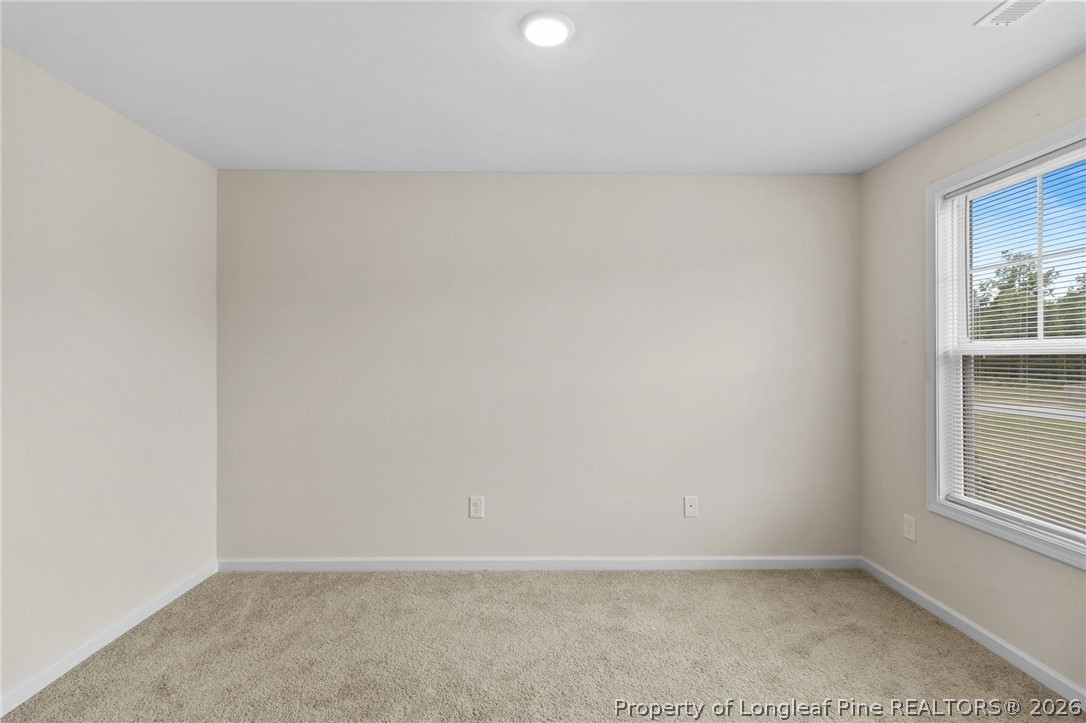 33 Pointer Way Parkton, NC 28371 - Photo 7 of 44 an empty room with windows