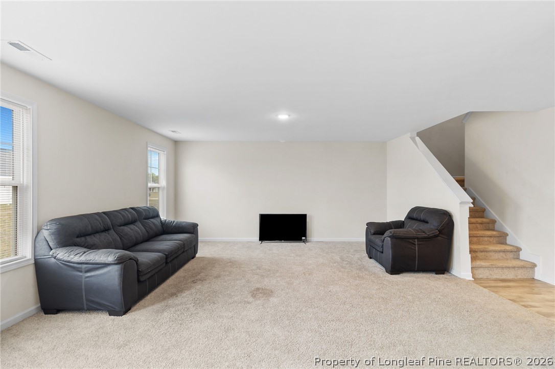 33 Pointer Way Parkton, NC 28371 - Photo 10 of 44 a living room with furniture and stairs