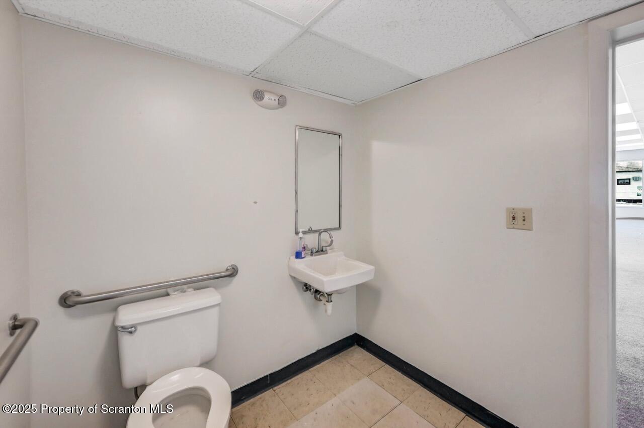 535 Green Ridge Street Scranton, PA 18509 - Photo 19 of 72 a bathroom with a sink and a mirror