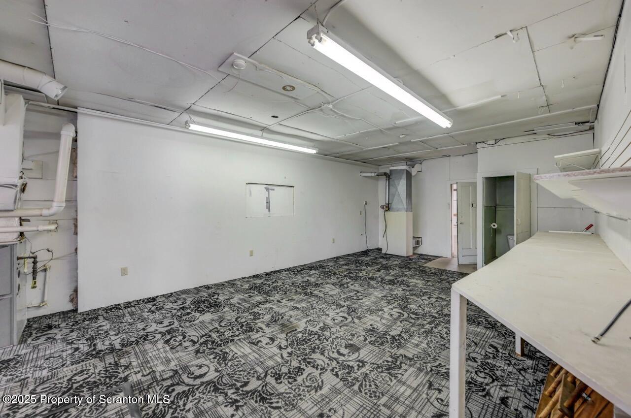 535 Green Ridge Street Scranton, PA 18509 - Photo 20 of 72 a view of a room with a bed and wooden floor