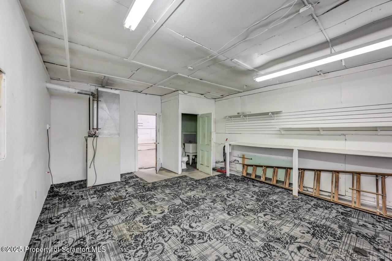 535 Green Ridge Street Scranton, PA 18509 - Photo 22 of 72 an empty room with wooden floor and a window