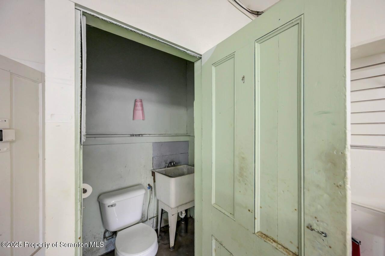 535 Green Ridge Street Scranton, PA 18509 - Photo 24 of 72 a bathroom with a toilet and a sink