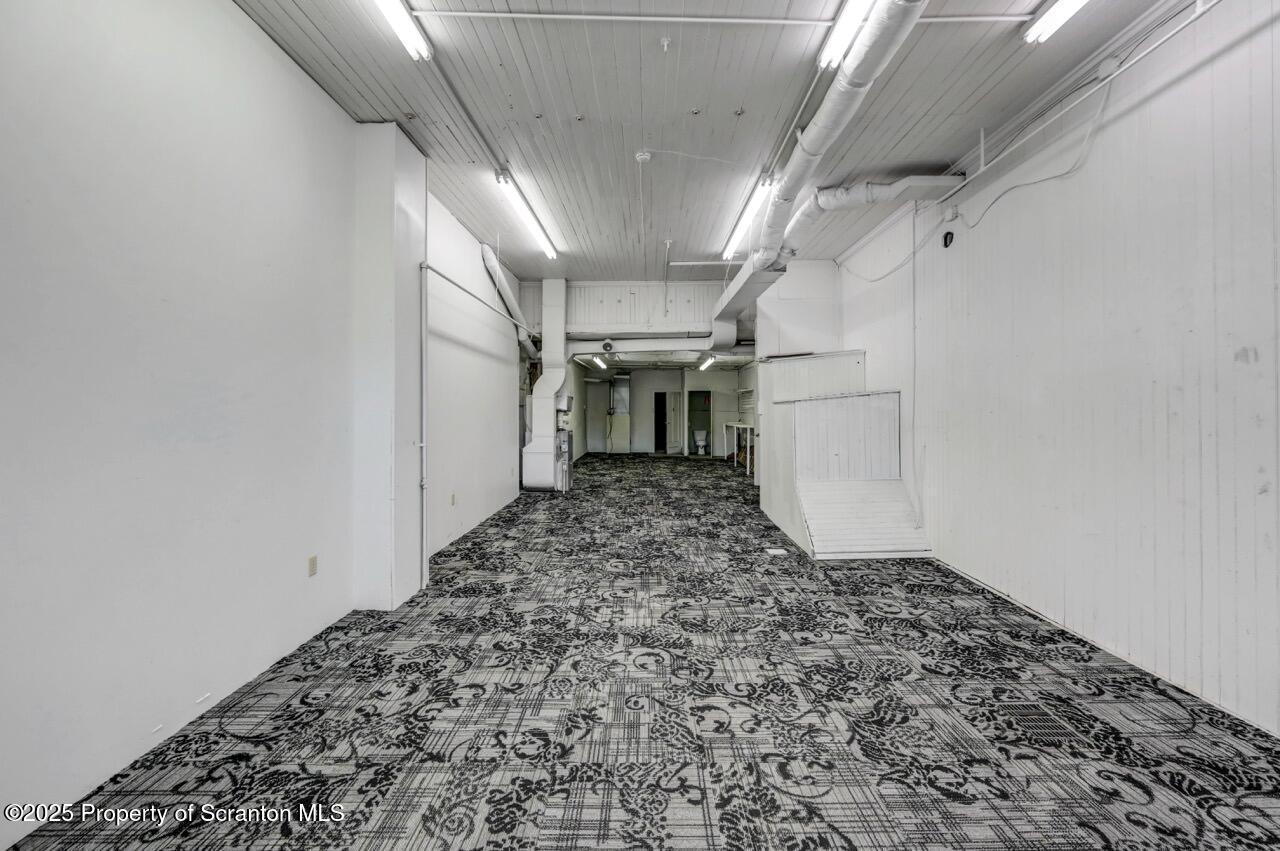 535 Green Ridge Street Scranton, PA 18509 - Photo 28 of 72 a view of a hallway with wooden walls