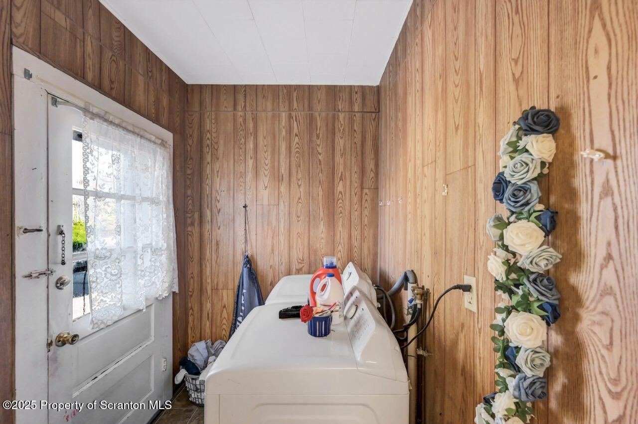 535 Green Ridge Street Scranton, PA 18509 - Photo 33 of 72 a bedroom with a bed and a potted plant