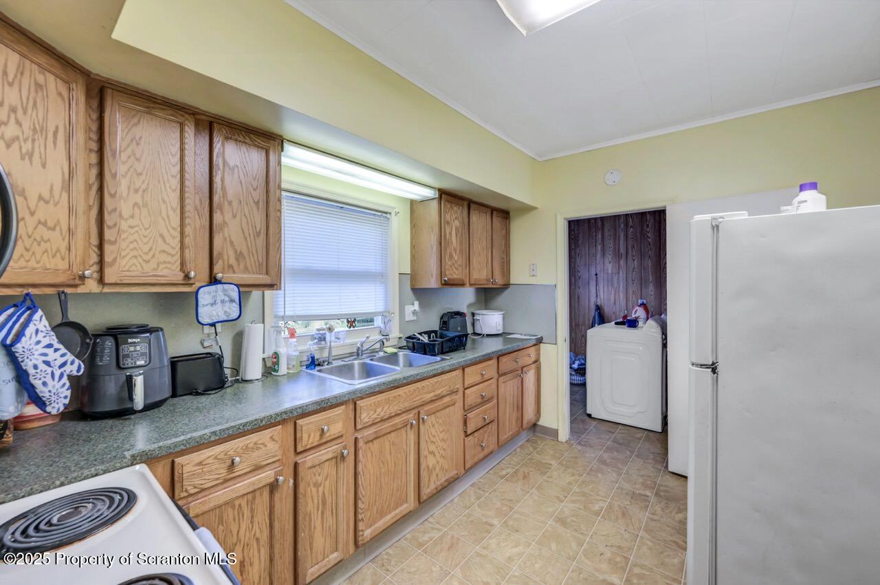 535 Green Ridge Street Scranton, PA 18509 - Photo 34 of 72 a kitchen with stainless steel appliances granite countertop a refrigerator sink and cabinets