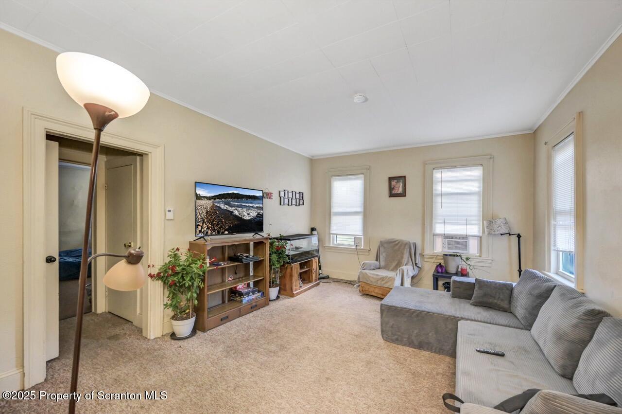 535 Green Ridge Street Scranton, PA 18509 - Photo 40 of 72 a living room with furniture and a window
