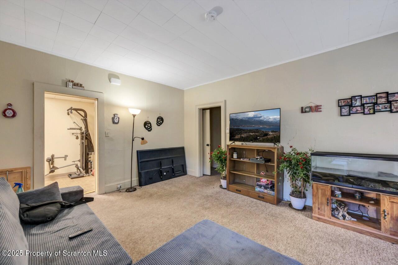 535 Green Ridge Street Scranton, PA 18509 - Photo 42 of 72 a bedroom with furniture and a flat screen tv