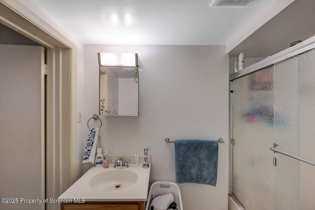 535 Green Ridge Street Scranton, PA 18509 - Photo 46 of 72 a bathroom with a sink toilet and shower