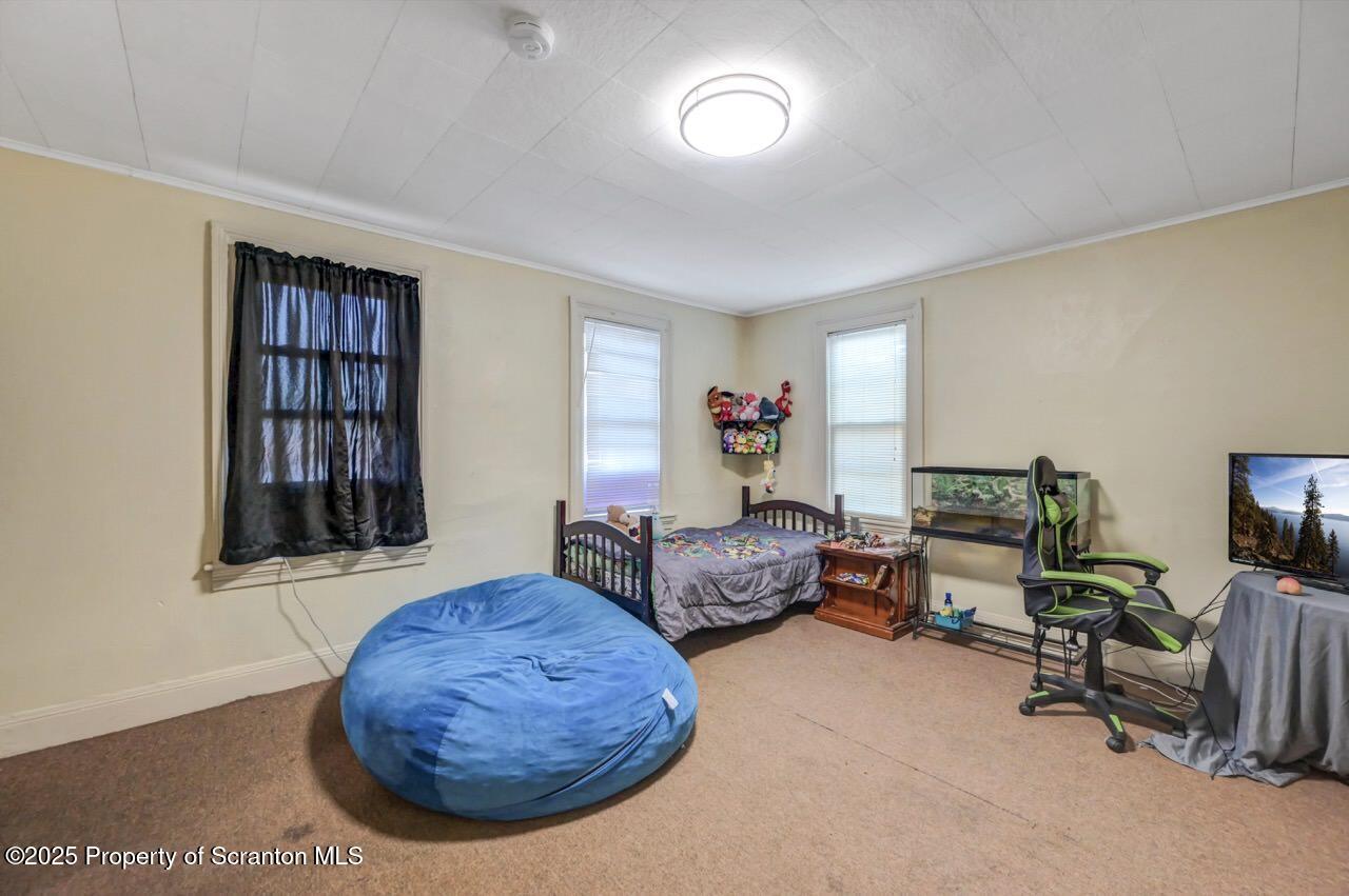 535 Green Ridge Street Scranton, PA 18509 - Photo 47 of 72 a living room with furniture and a flat screen tv