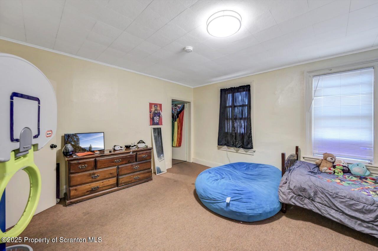 535 Green Ridge Street Scranton, PA 18509 - Photo 48 of 72 a bedroom with a bed and furniture