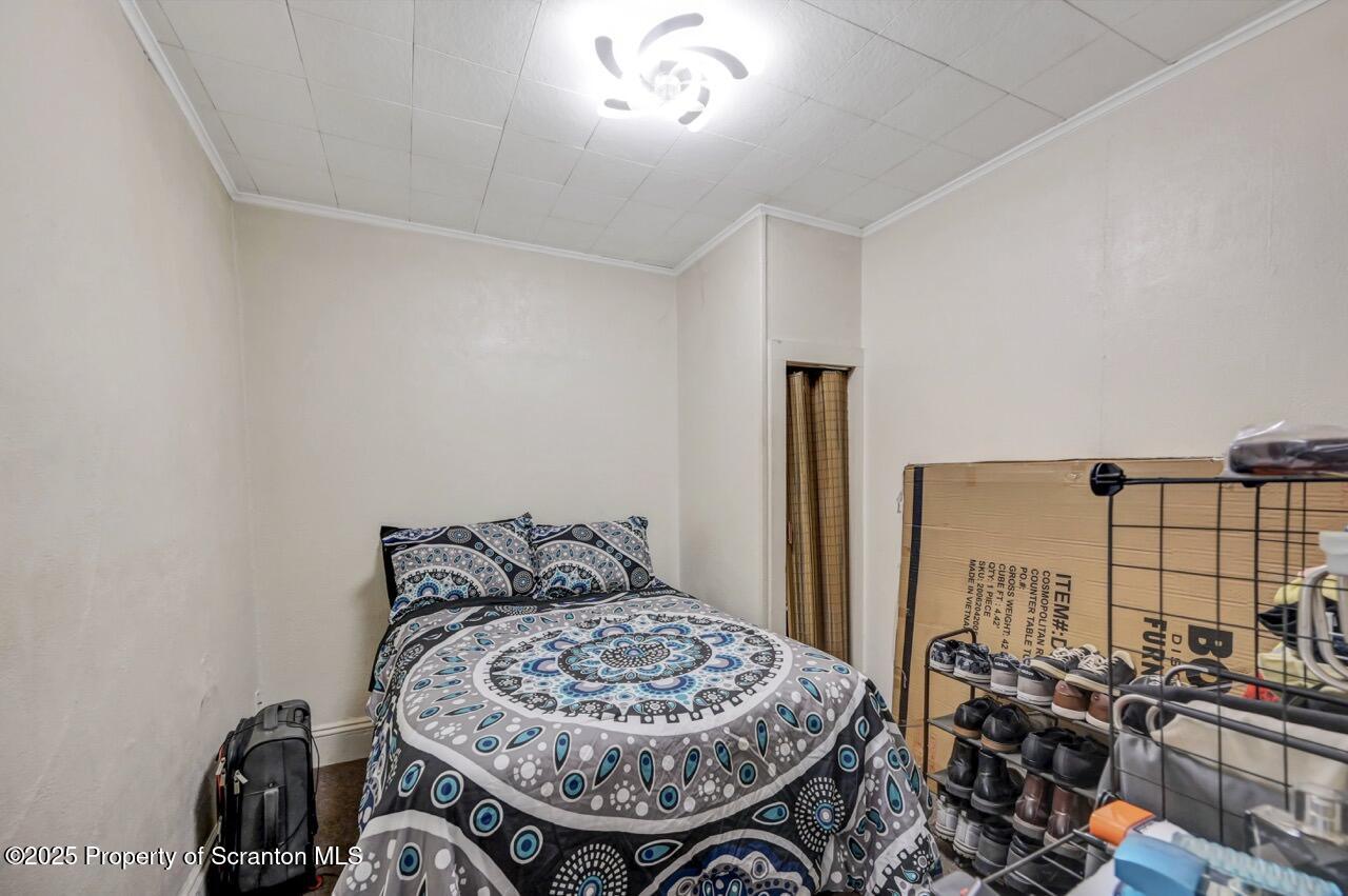 535 Green Ridge Street Scranton, PA 18509 - Photo 60 of 72 a bedroom with a bed and a dresser