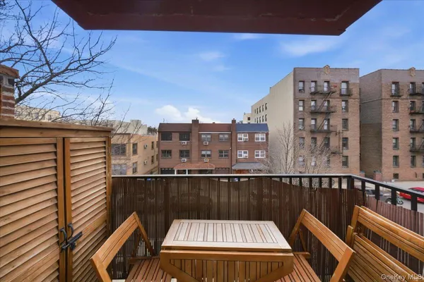 a view of roof deck with city view and wooden floor
