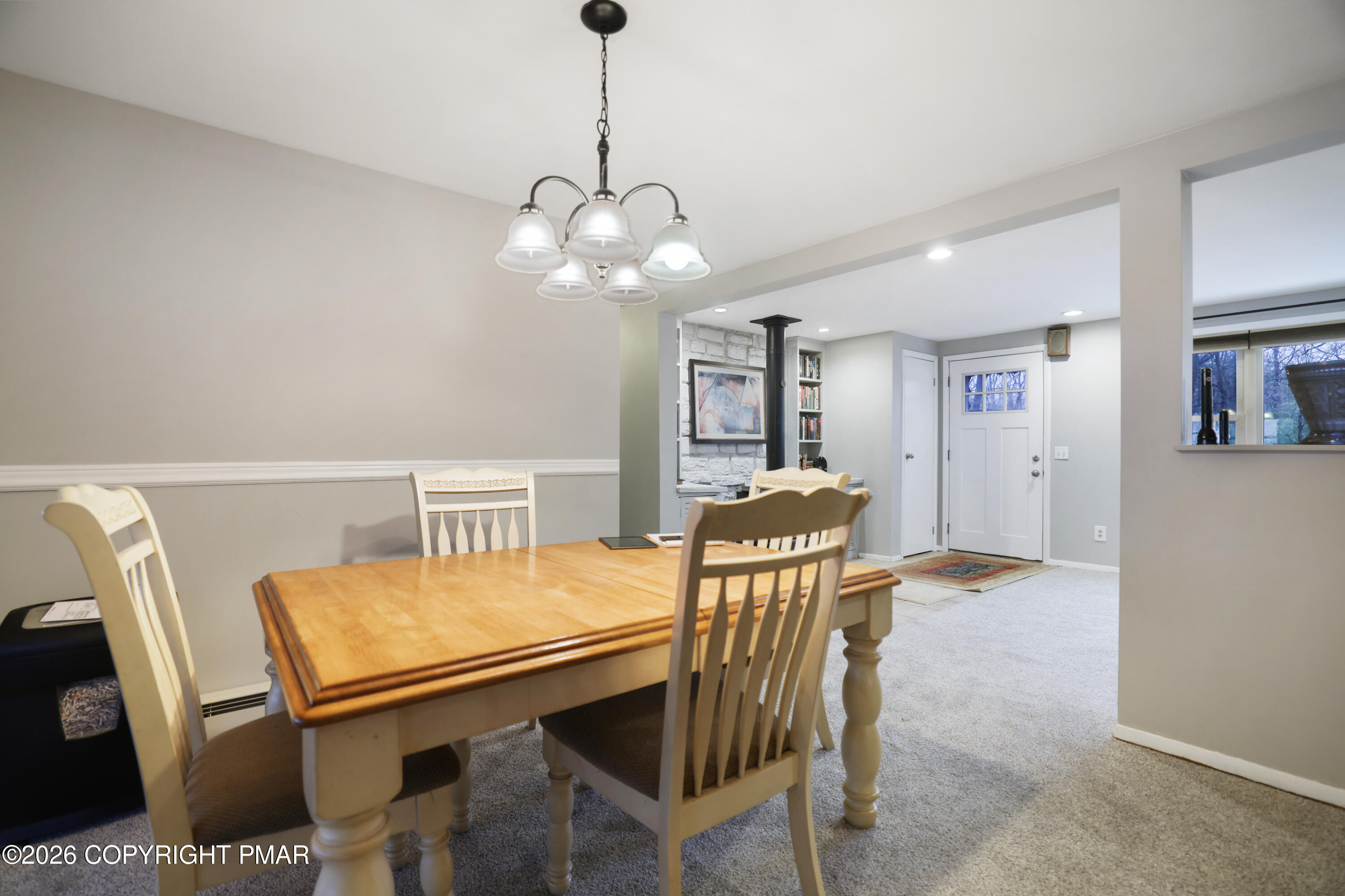 1107 Mink Trail Bushkill, PA 18324 - Photo 13 of 42 a view of a dining room with furniture and chandelier