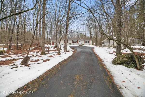 a view of snow on the side of the road