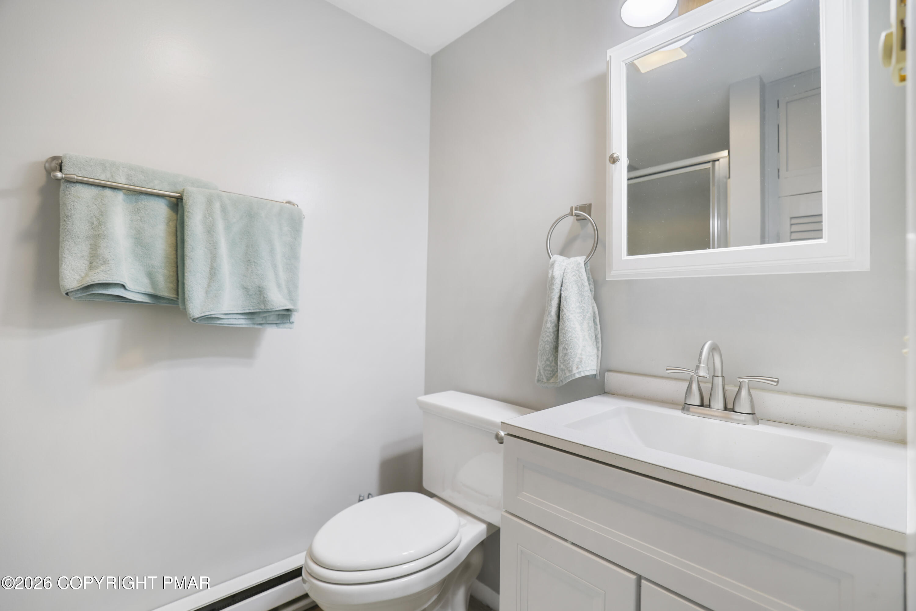 1107 Mink Trail Bushkill, PA 18324 - Photo 25 of 42 a white toilet sitting next to a bathroom sink
