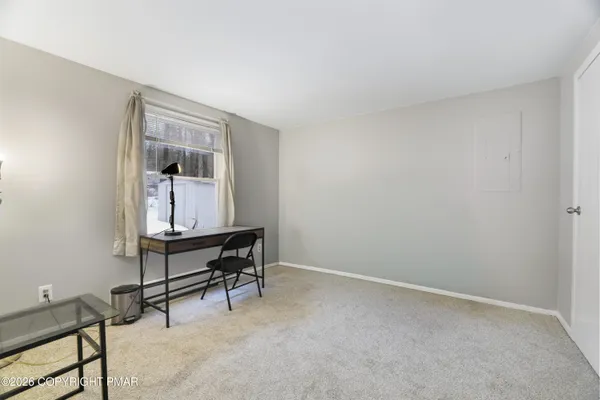a view of livingroom with furniture and a chair