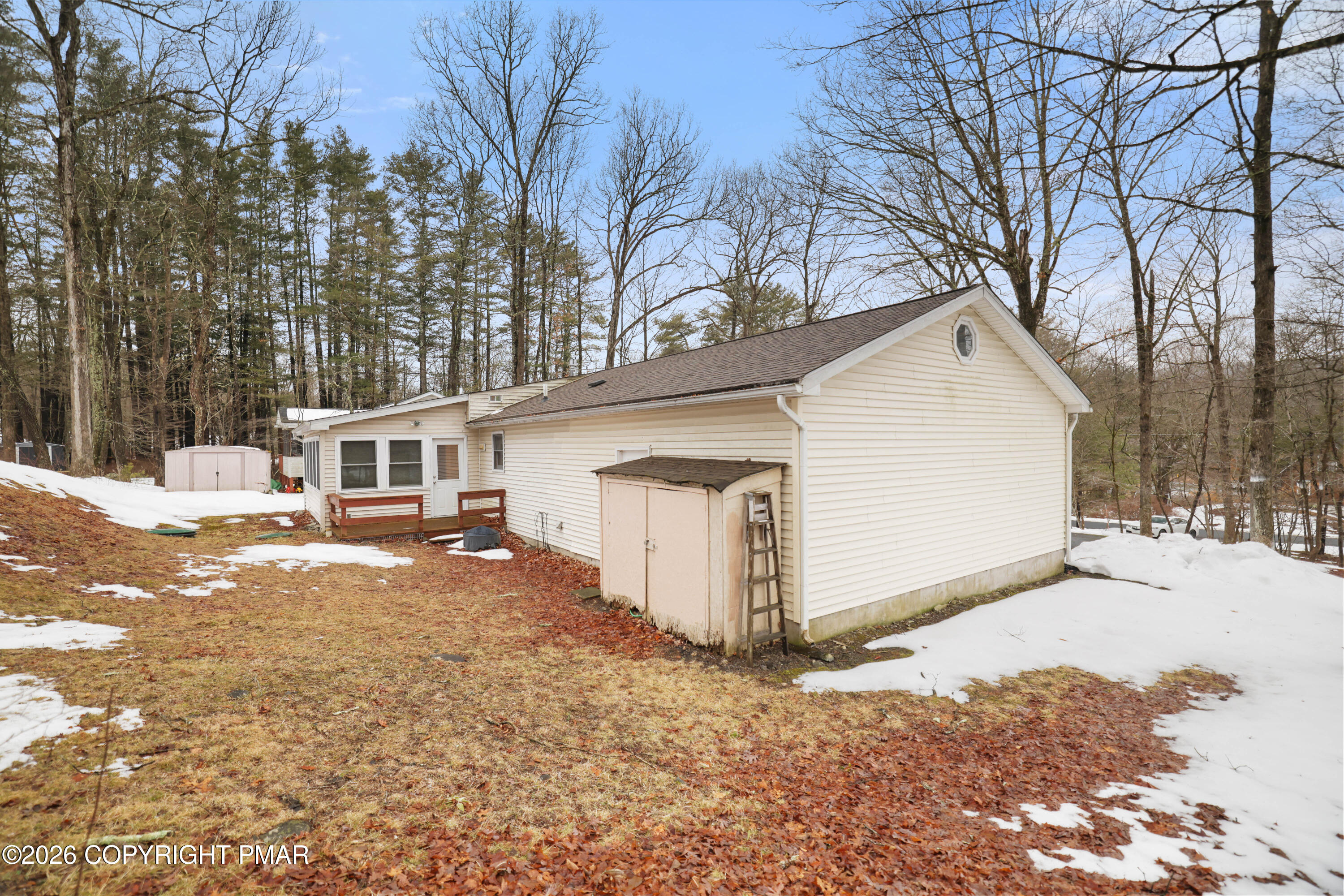 1107 Mink Trail Bushkill, PA 18324 - Photo 34 of 42 a view of a house with a yard covered in snow
