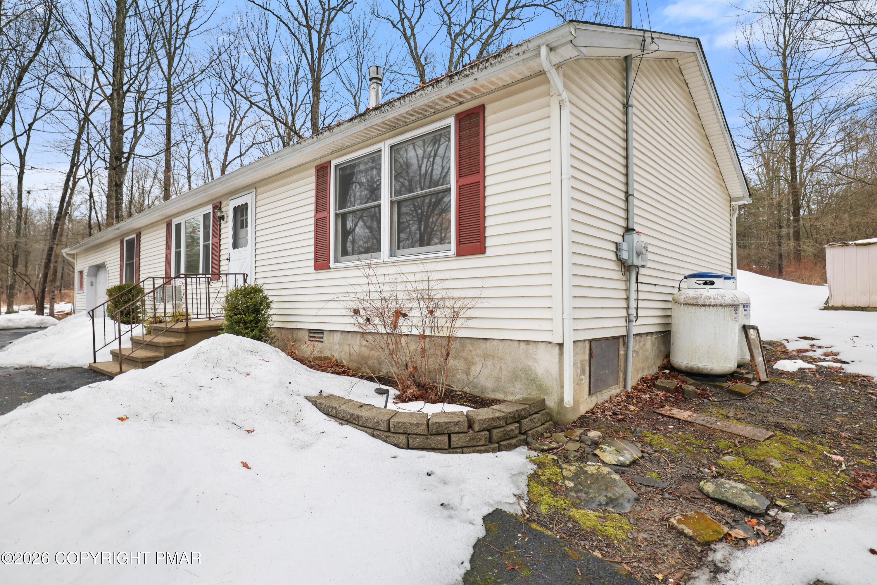 1107 Mink Trail Bushkill, PA 18324 - Photo 36 of 42 a front view of a house with a yard