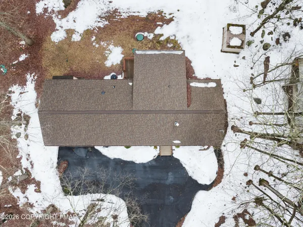 a aerial view of a house with a yard
