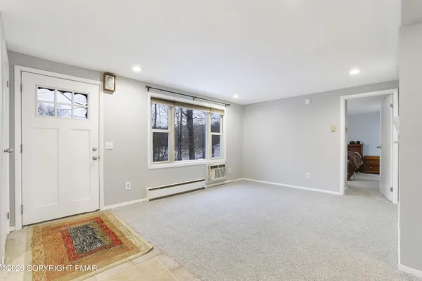 a view of an empty room with a window