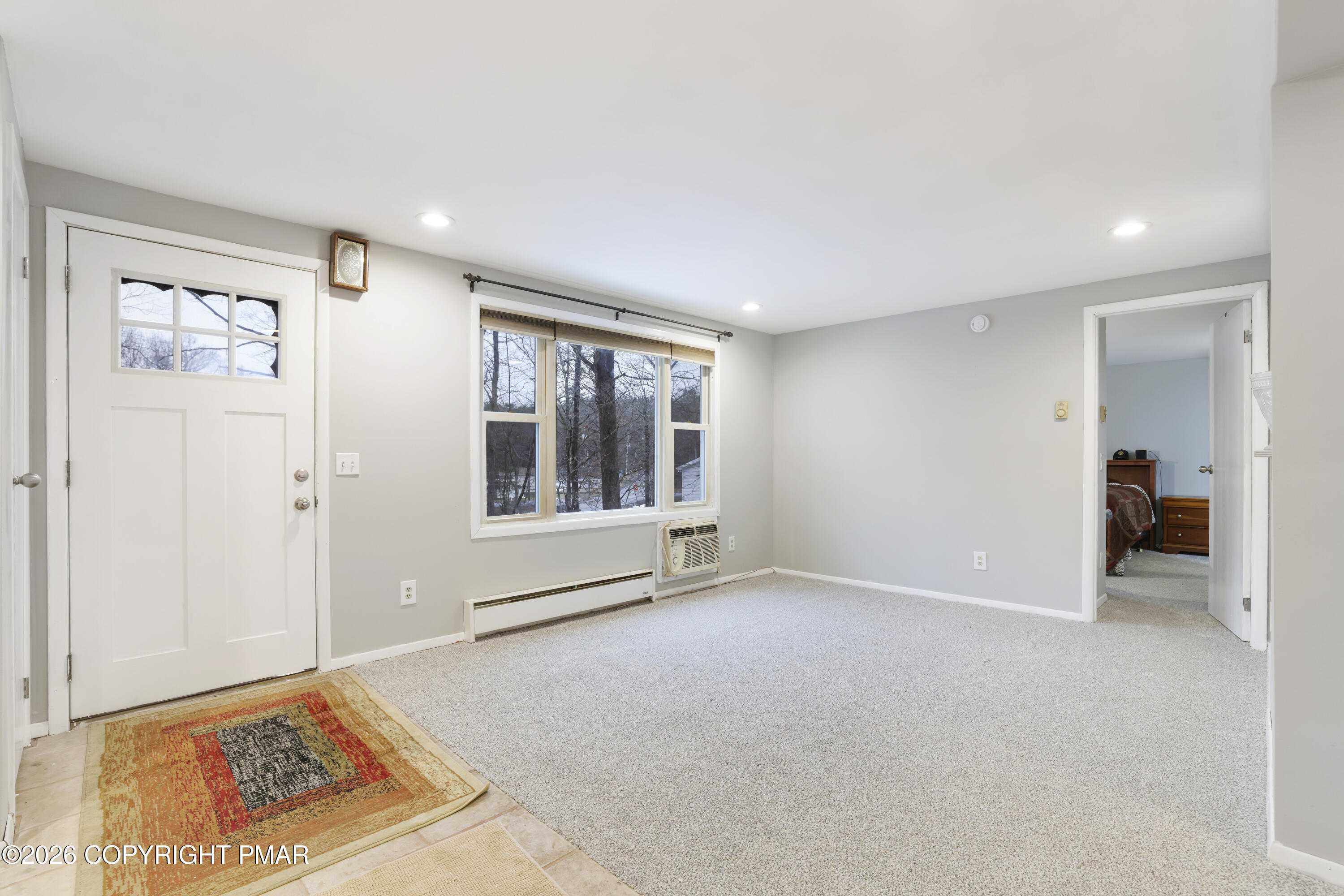 1107 Mink Trail Bushkill, PA 18324 - Photo 7 of 42 a view of an empty room with a window