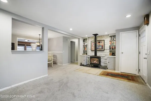 a view of a livingroom with furniture and a flat screen tv