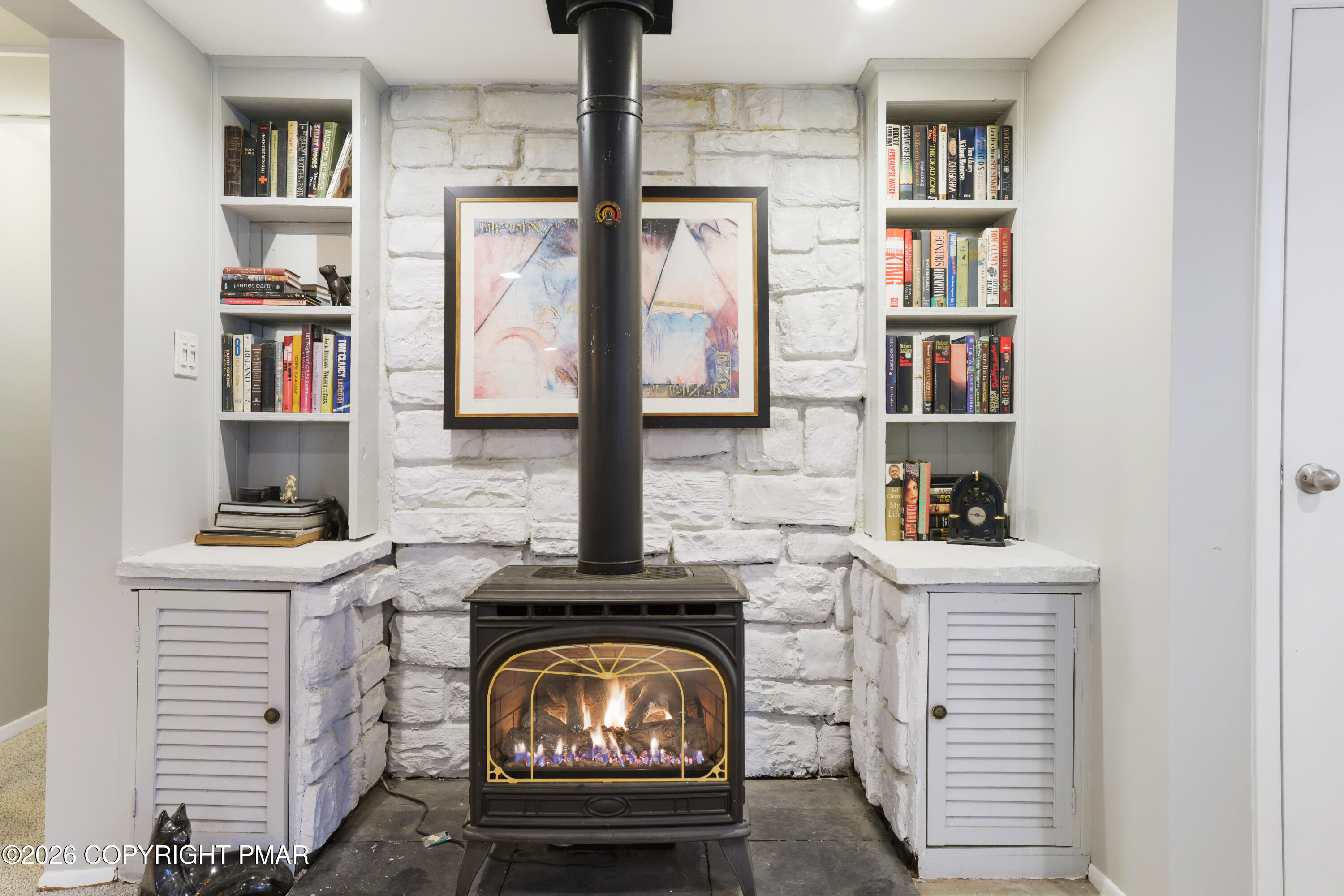 1107 Mink Trail Bushkill, PA 18324 - Photo 10 of 42 a living room with furniture and a fireplace
