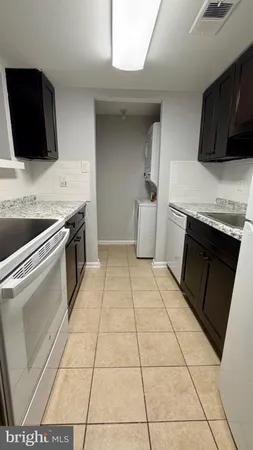 a kitchen with a stove and a sink