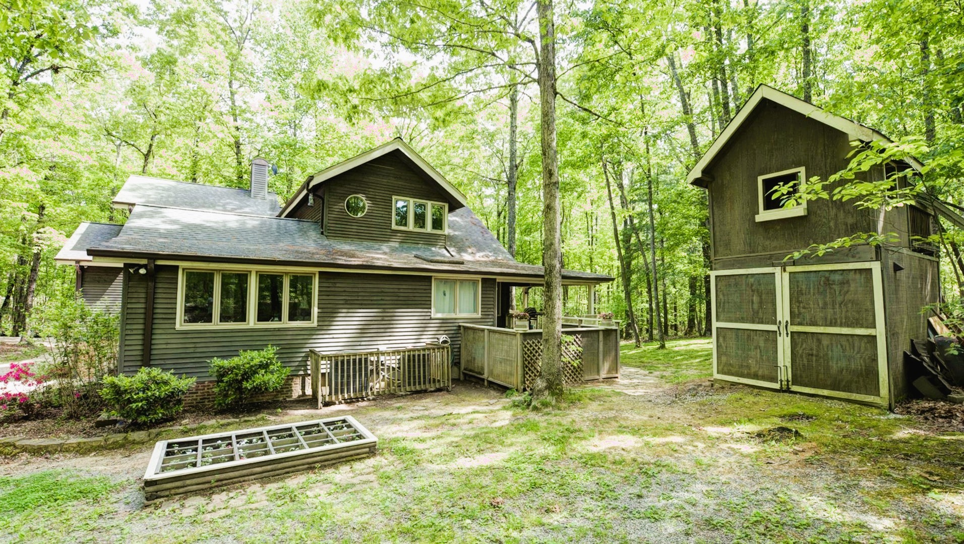 727 Deepwoods Road Sewanee, TN 37375 - Photo 20 of 21 a front view of a house with a yard table and chairs