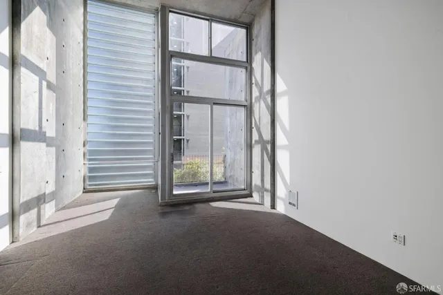 a view of front door with wooden floor