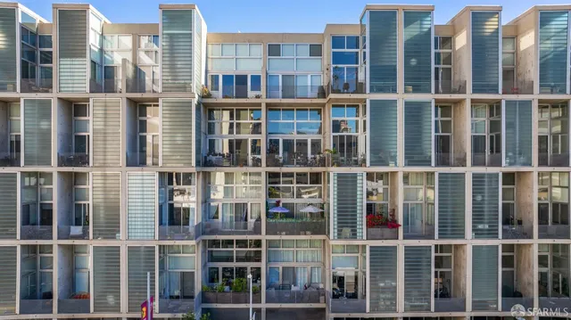 a view of a livingroom with furniture and a window