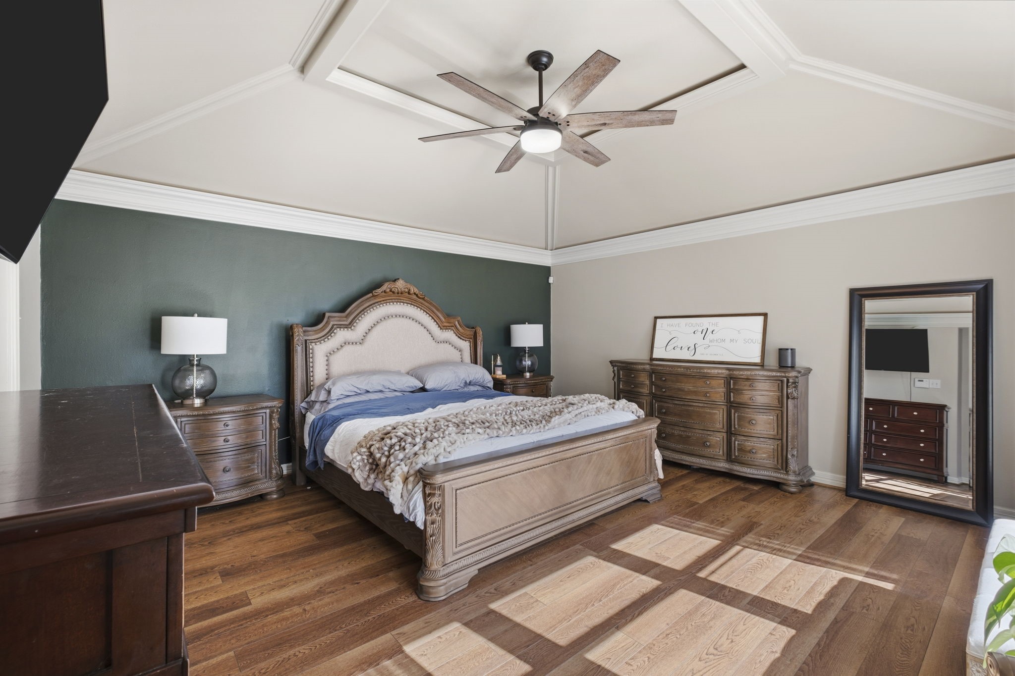 20322 Cembra Walk Spring, TX 77379 - Photo 18 of 47 a bedroom with a bed and a chandelier