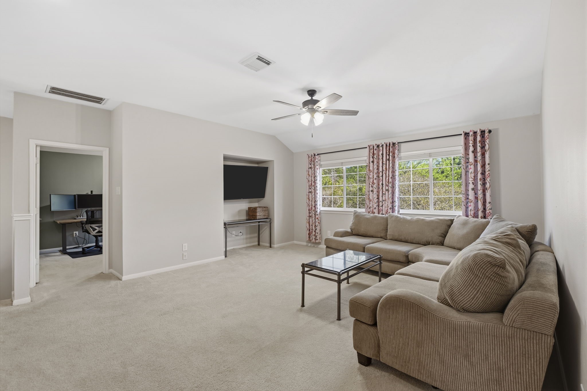 20322 Cembra Walk Spring, TX 77379 - Photo 23 of 47 a living room with furniture and a flat screen tv