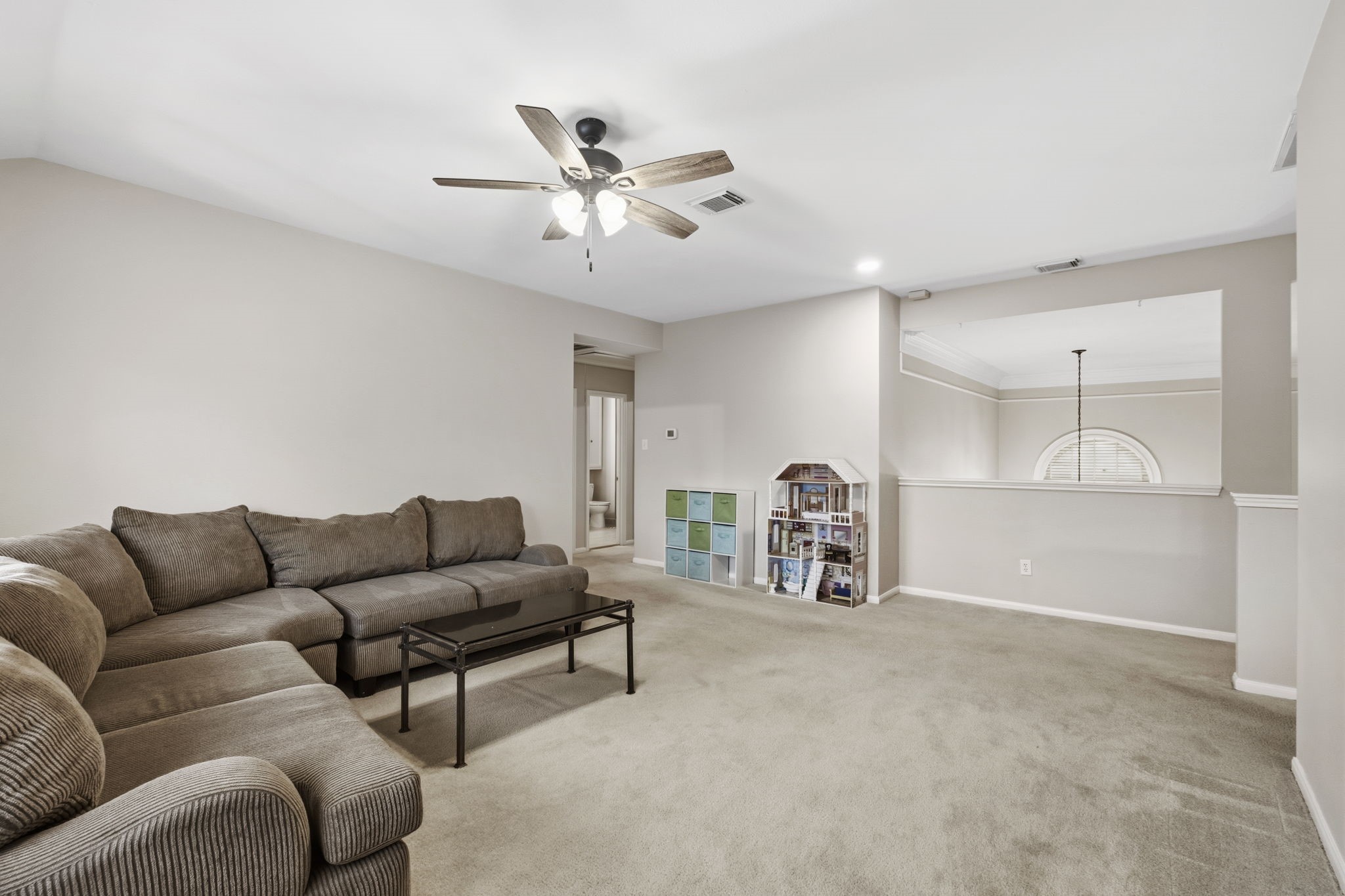 20322 Cembra Walk Spring, TX 77379 - Photo 24 of 47 a living room with furniture and a large mirror with projector